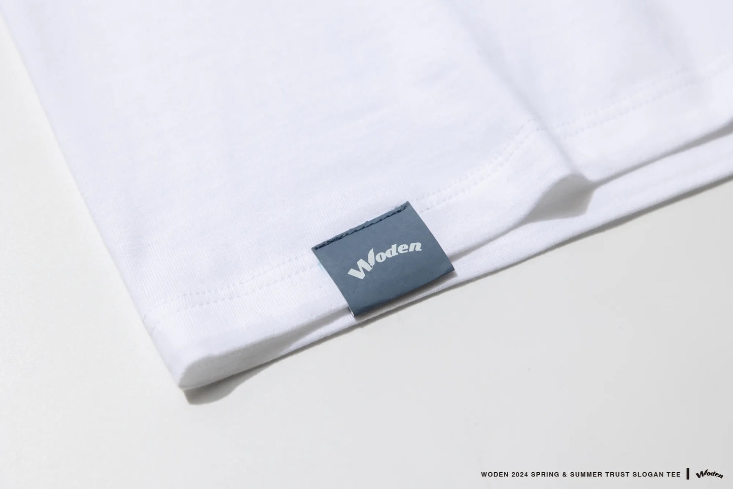WODEN 2024 SPRING & SUMMER TRUST SLOGAN TEE